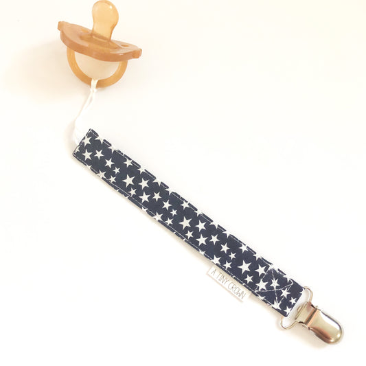 White Stars on Navy Fabric Pacifier Clip